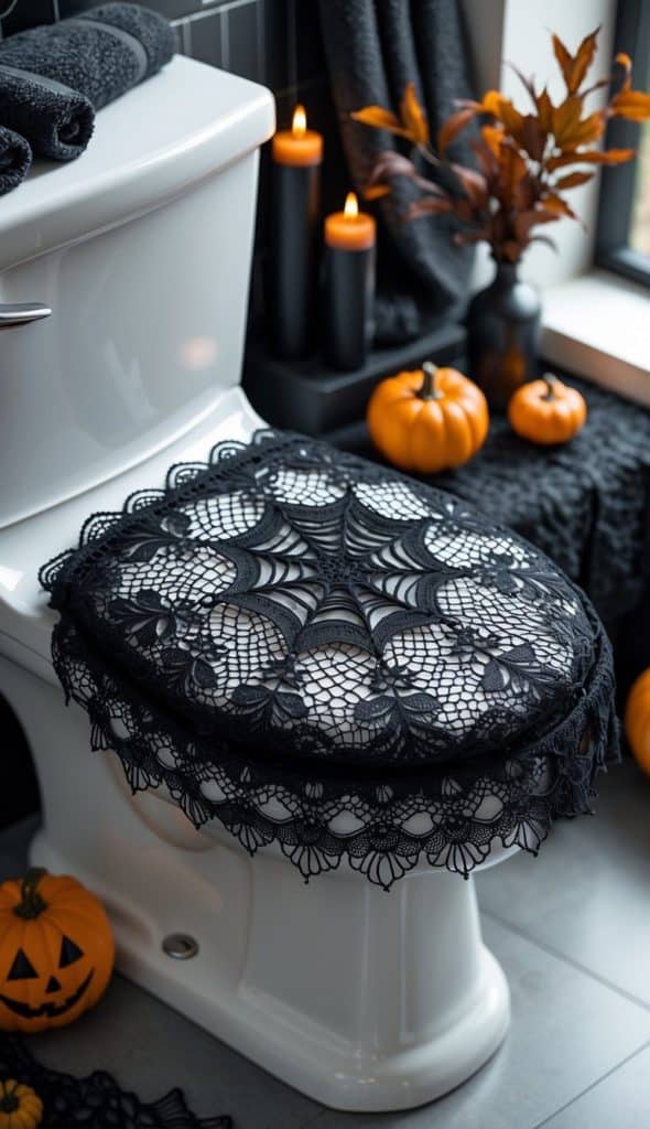 White toilet with a black lace spiderweb cover on the lid, surrounded by small pumpkins, candles, and autumn decor in a bathroom.