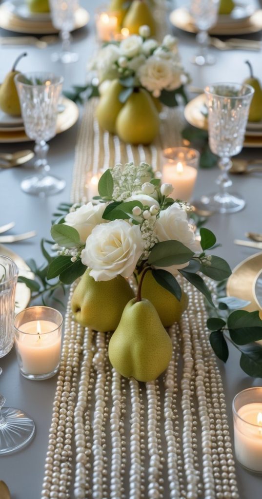 Elegant dining table set with gold plates, crystal glasses, white flowers, pears, pearl table runner, and lit candles arranged for a formal occasion.